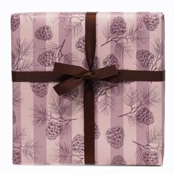 Beautiful Christmas wrapping paper with stripes and pine cones. Shown with a dark brown gift ribbon