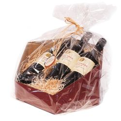 A wine-red cardboard gift basket wrapped in cellophane and twine